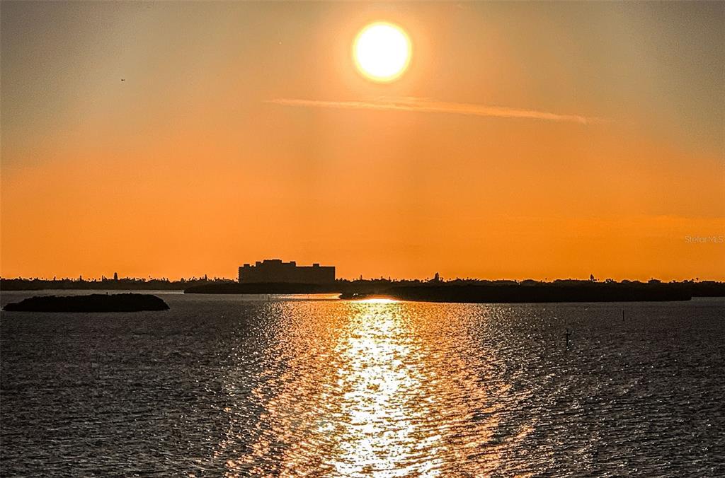 634 Edgewater Drive, Unit 447 Dunedin, FL 34698 - Photo 53 of 53 a view of ocean with sunset