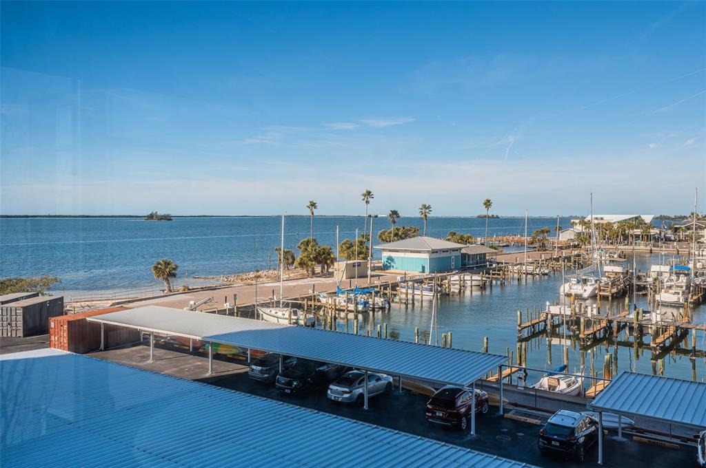 634 Edgewater Drive, Unit 447 Dunedin, FL 34698 - Photo 10 of 53 a terrace with outdoor seating and city view
