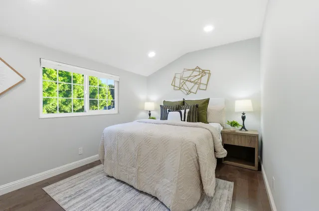 a bedroom with a bed and window