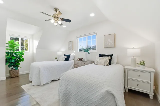 a bedroom with bed and a window