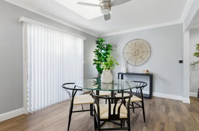a view of a dining room with furniture window and wooden floor
