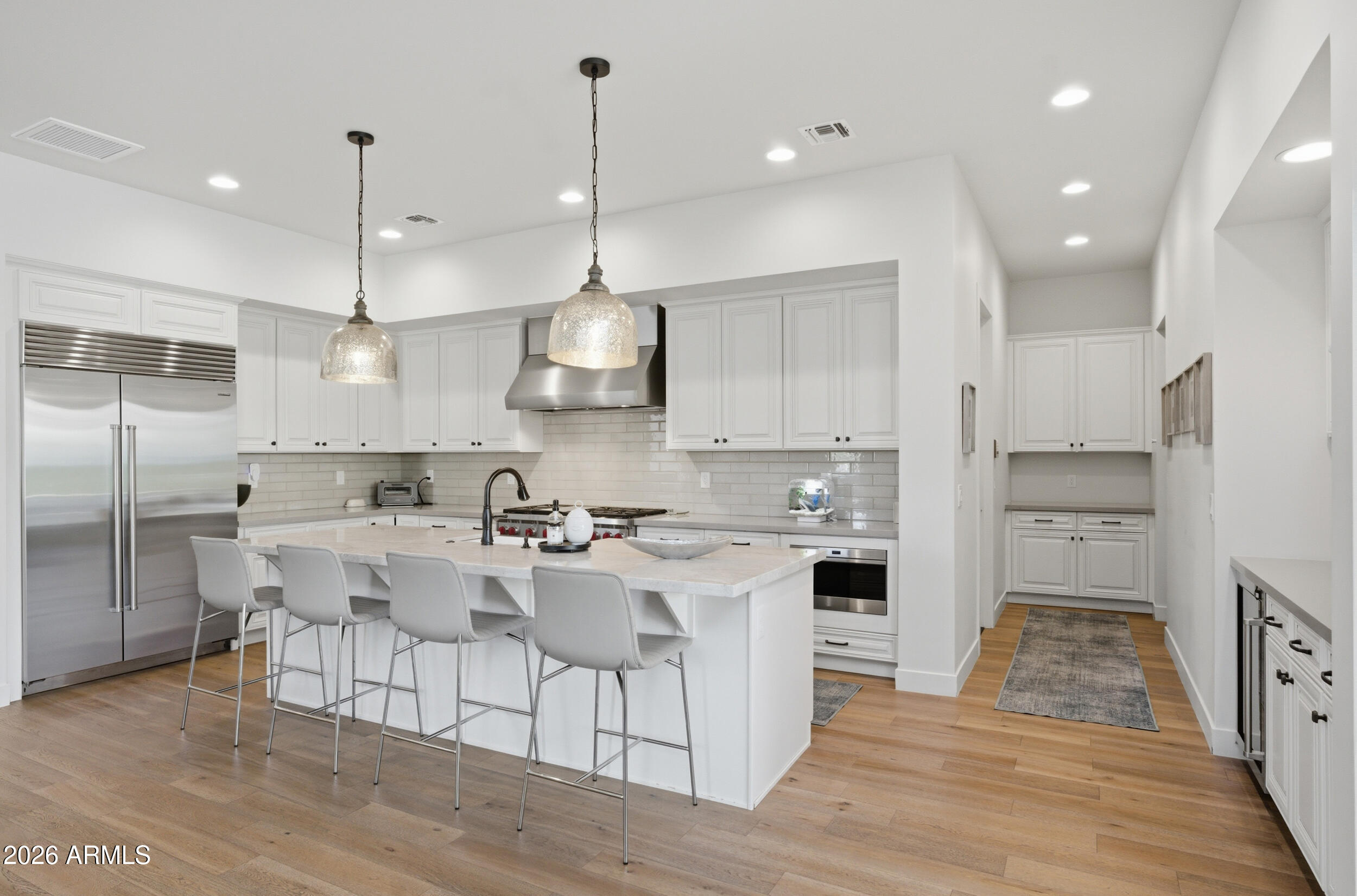40 West Frier Drive Phoenix, AZ 85021 - Photo 13 of 54 a kitchen with stainless steel appliances kitchen island a sink and a refrigerator