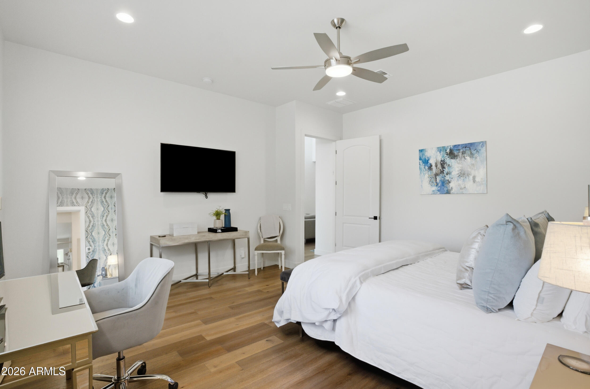 40 West Frier Drive Phoenix, AZ 85021 - Photo 20 of 54 a bedroom with a bed and a flat screen tv