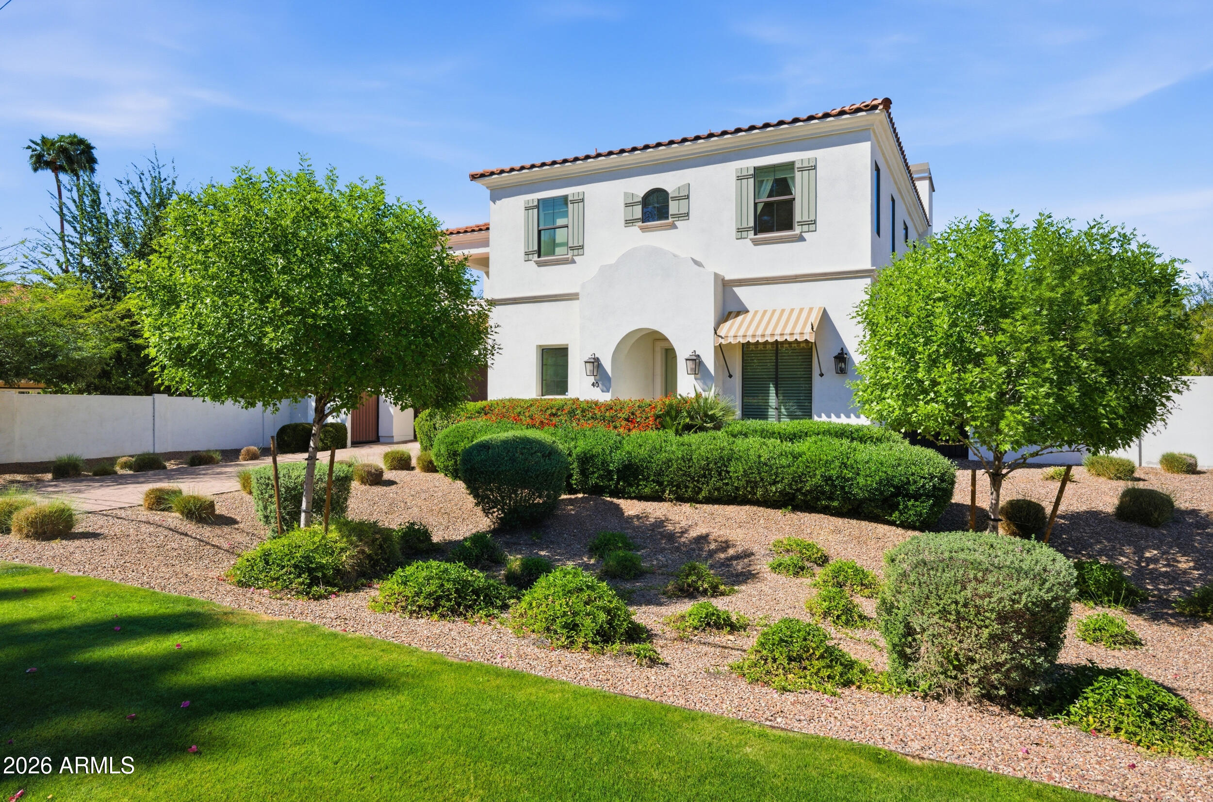 40 West Frier Drive Phoenix, AZ 85021 - Photo 2 of 54 a front view of a house with garden