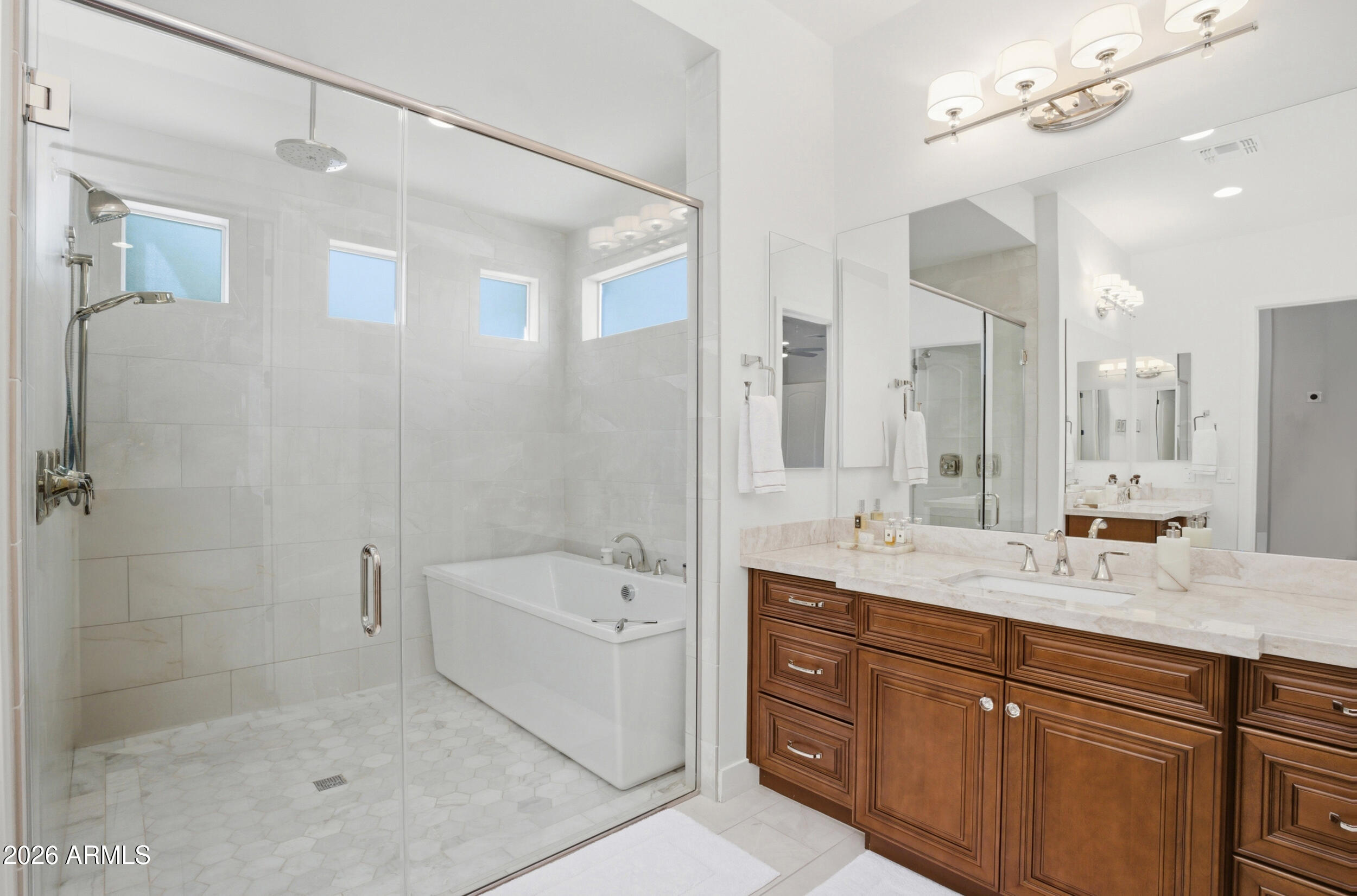 40 West Frier Drive Phoenix, AZ 85021 - Photo 22 of 54 a bathroom with a sink double vanity granite tub shower and a mirror