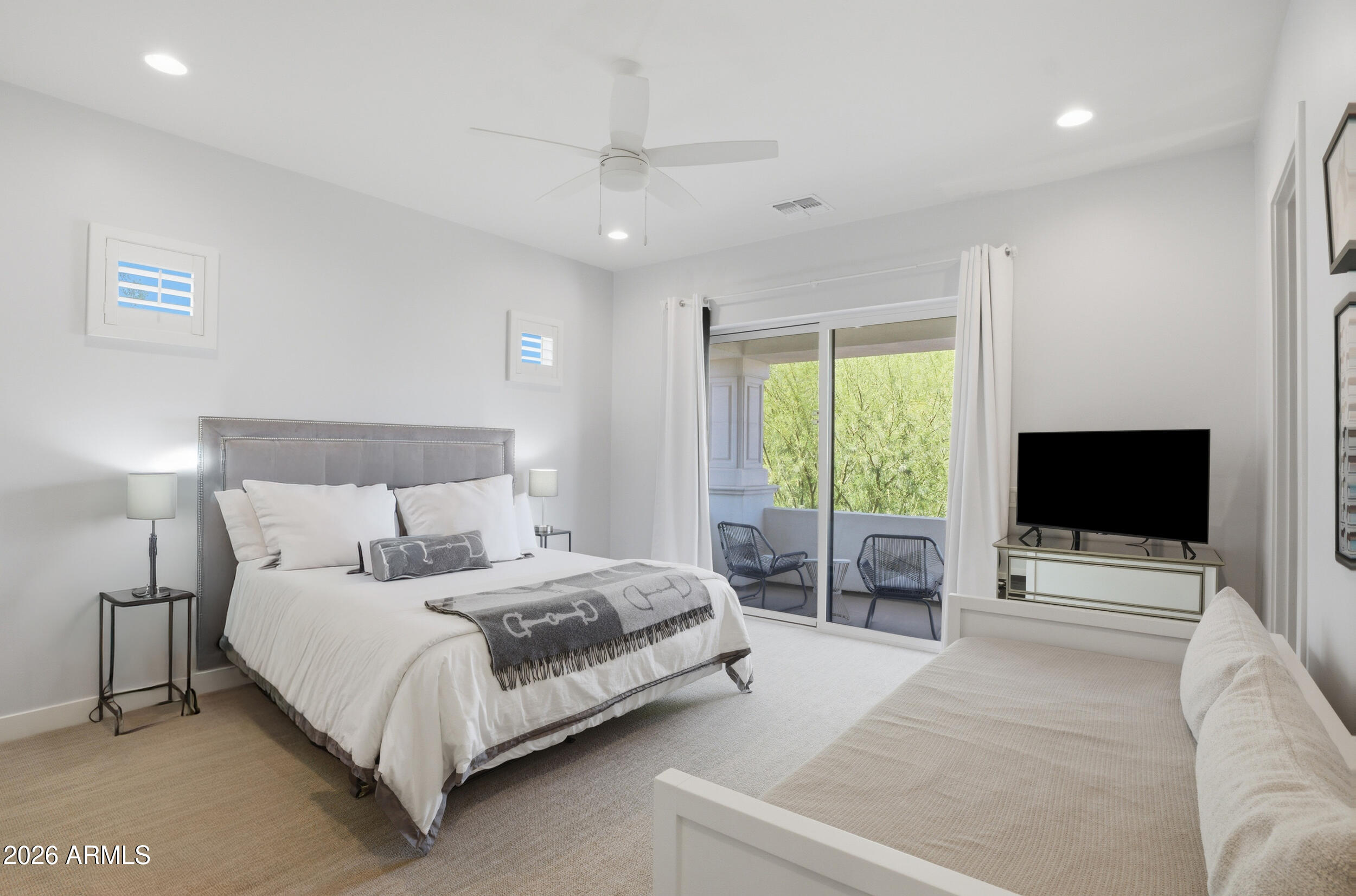 40 West Frier Drive Phoenix, AZ 85021 - Photo 28 of 54 a bedroom with a bed and a flat screen tv