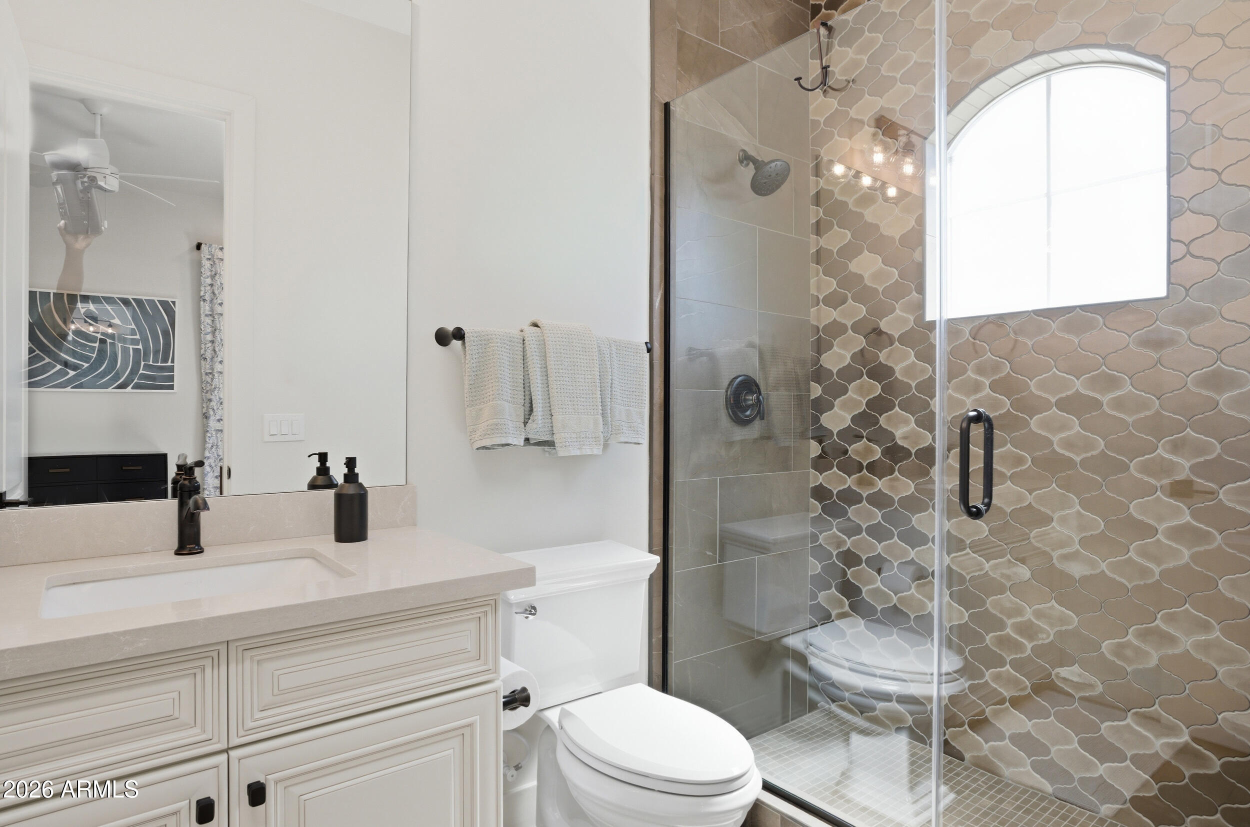 40 West Frier Drive Phoenix, AZ 85021 - Photo 36 of 54 a bathroom with a toilet a sink and shower