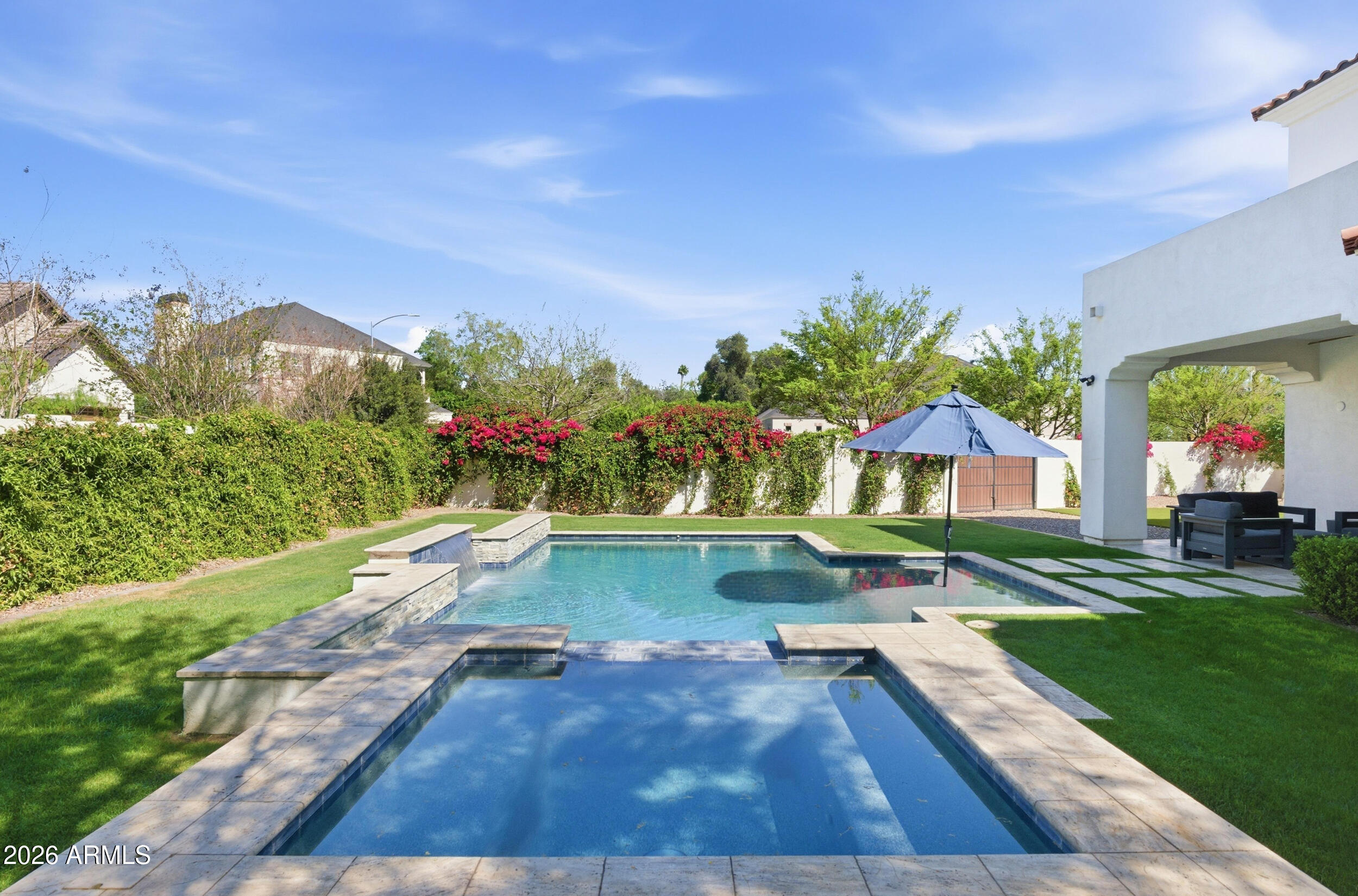 40 West Frier Drive Phoenix, AZ 85021 - Photo 43 of 54 a view of a swimming pool with a yard and potted plants