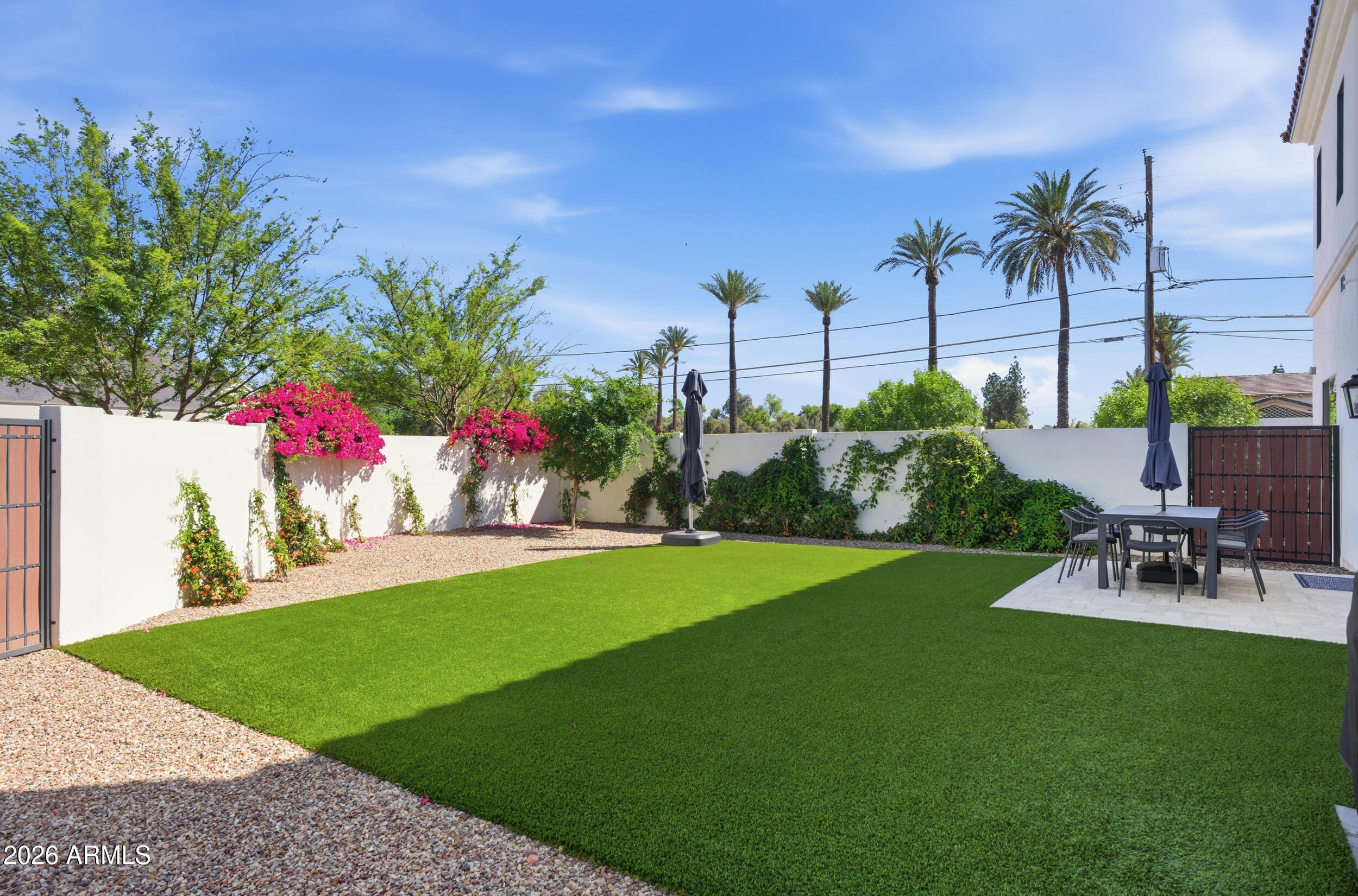 40 West Frier Drive Phoenix, AZ 85021 - Photo 48 of 54 a view of a chair and tables in the garden
