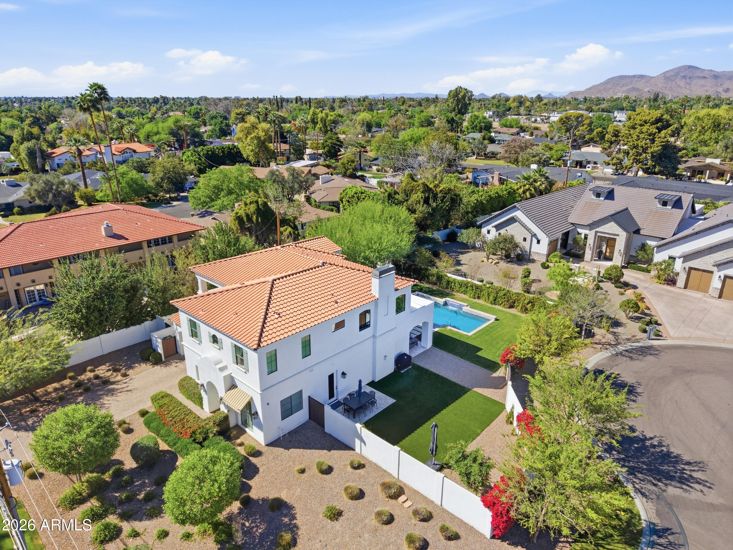 40 West Frier Drive Phoenix, AZ 85021 - Photo 49 of 54 an aerial view of a houses with a swimming pool lake and mountain view