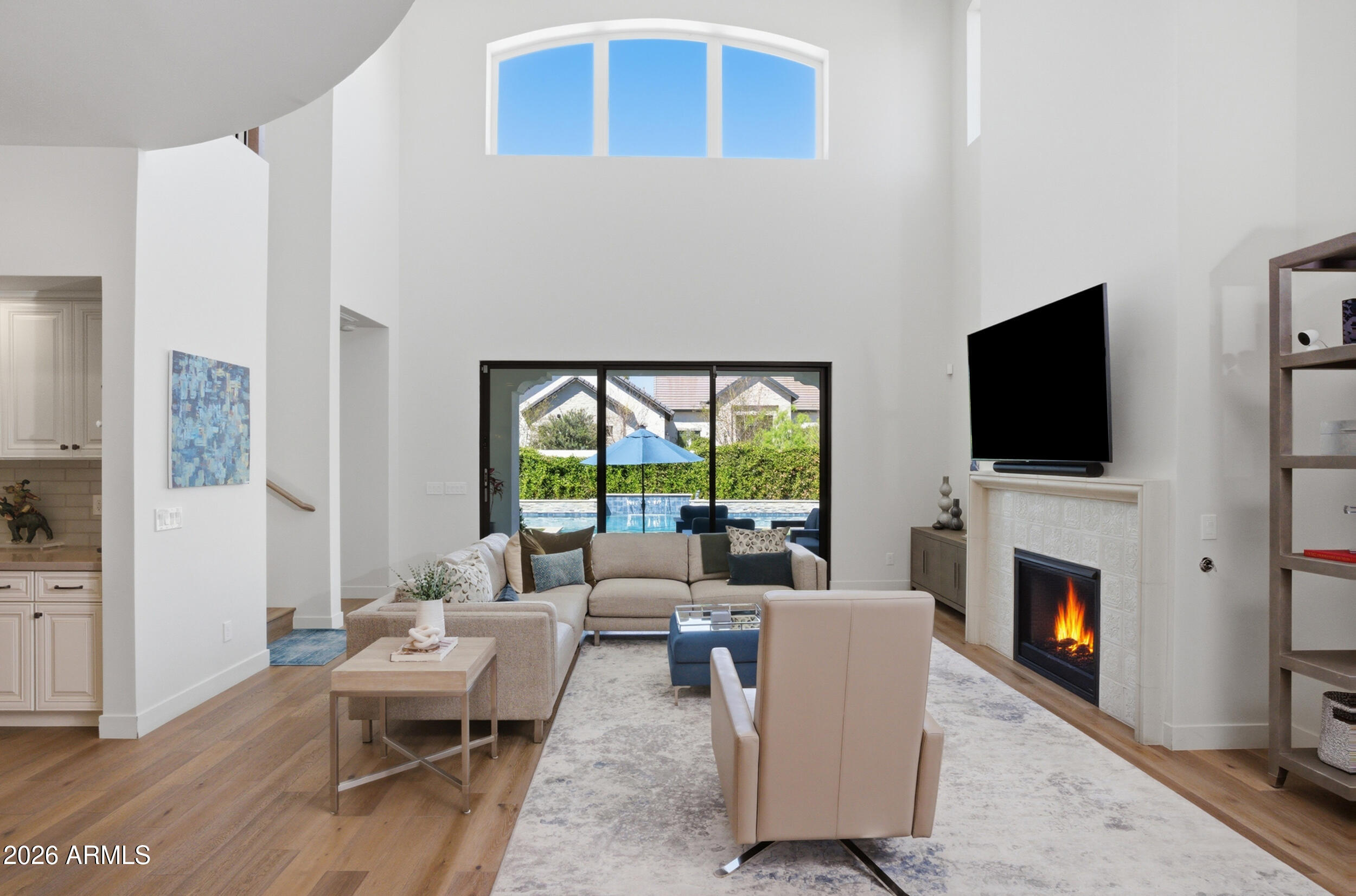 40 West Frier Drive Phoenix, AZ 85021 - Photo 5 of 54 a living room with furniture a flat screen tv and a fireplace