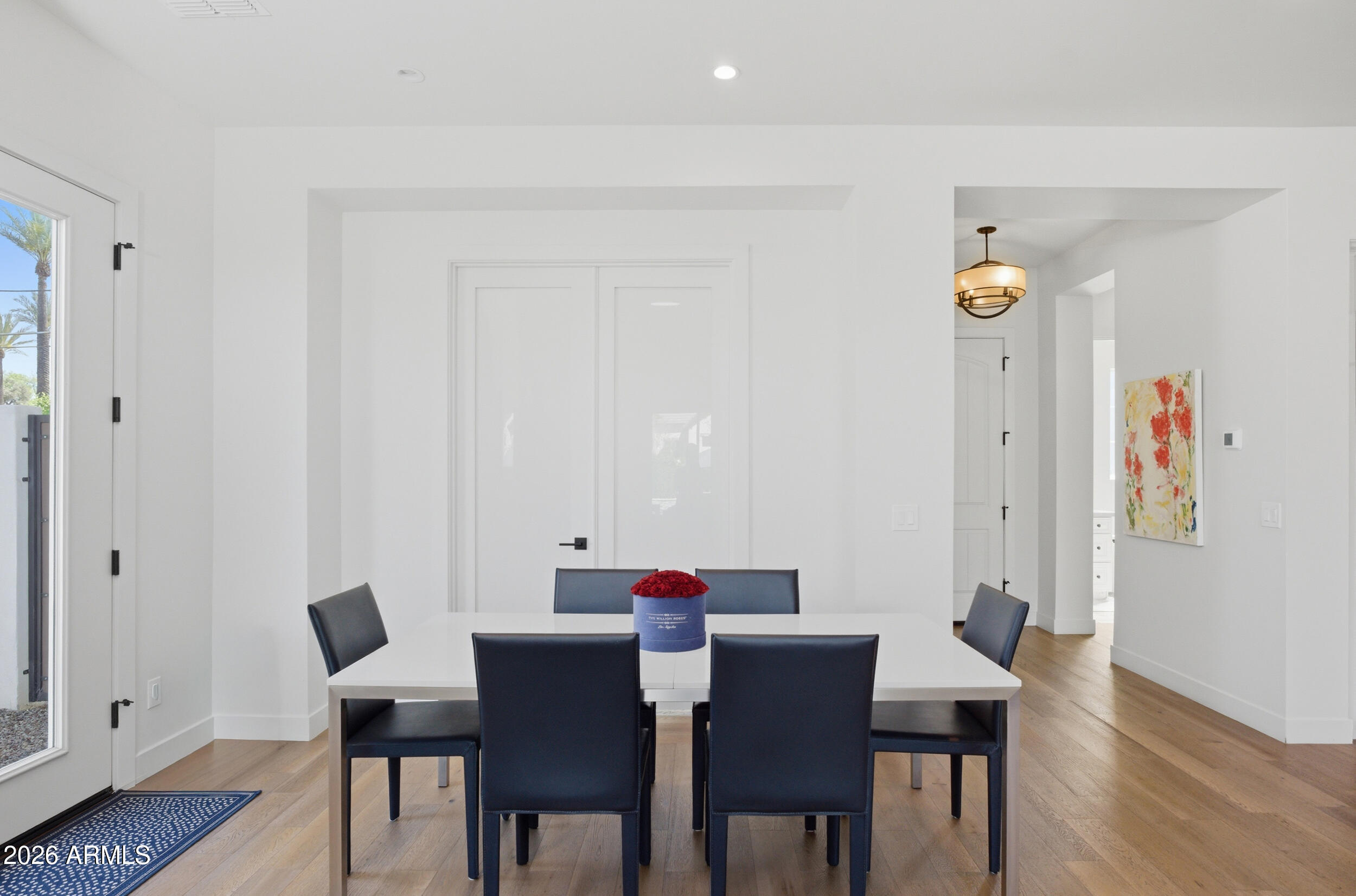 40 West Frier Drive Phoenix, AZ 85021 - Photo 8 of 54 a view of a dining room with furniture and wooden floor