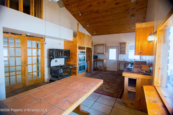 a room with furniture pool table and flat screen tv