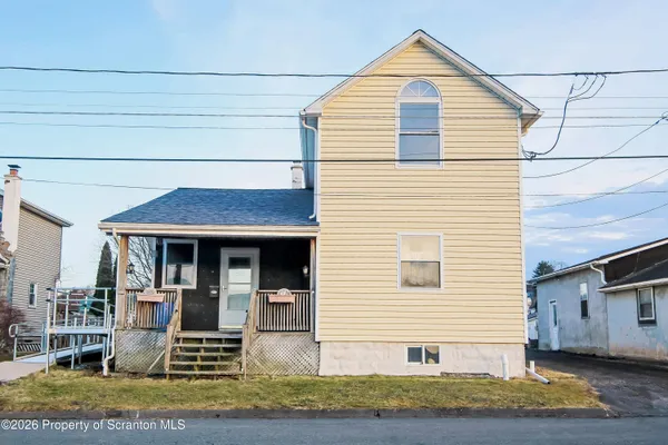 a view of house with yard