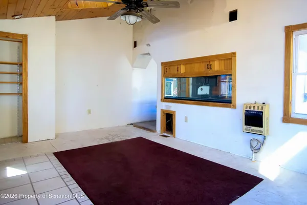 a living room with a flat screen tv and a table