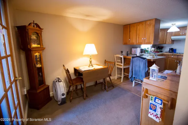 a workspace with furniture and a fireplace