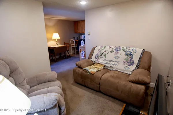 a living room with furniture and a couch