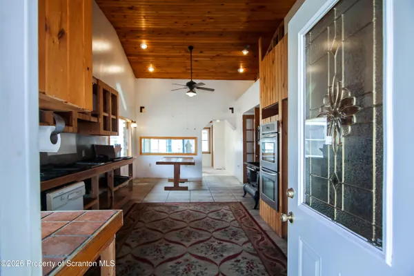 a lobby with furniture and a potted plant