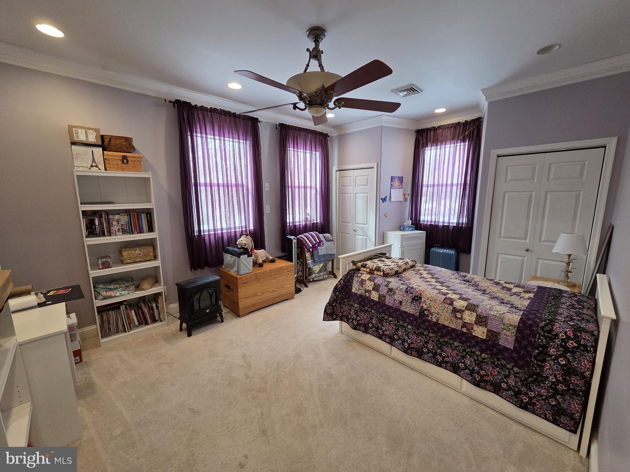 1028 Blackbird Landing Road Townsend, DE 19734 - Photo 11 of 30 a bedroom with a large bed and a chandelier