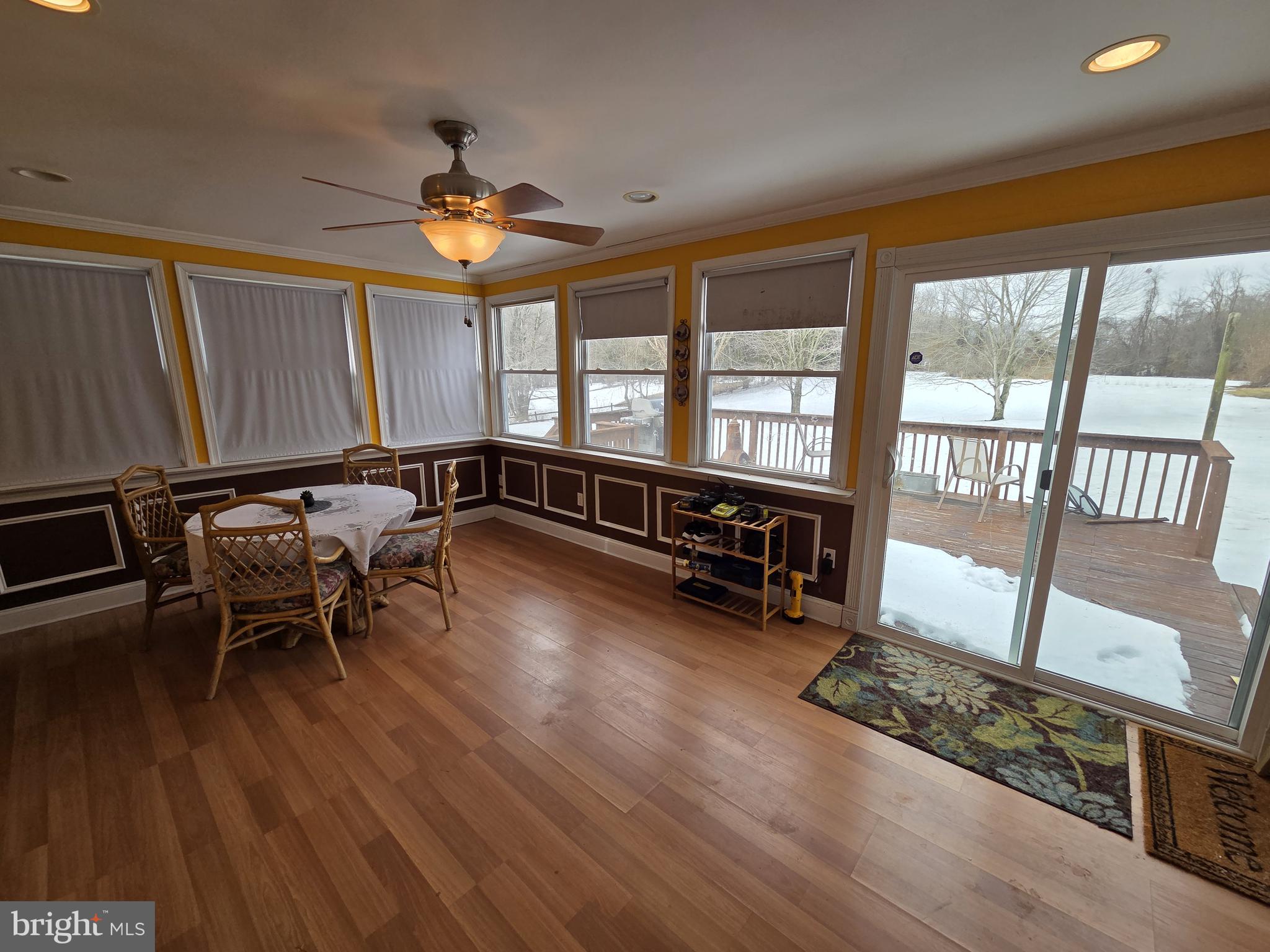 1028 Blackbird Landing Road Townsend, DE 19734 - Photo 14 of 30 a view of a dining room with furniture window and wooden floor