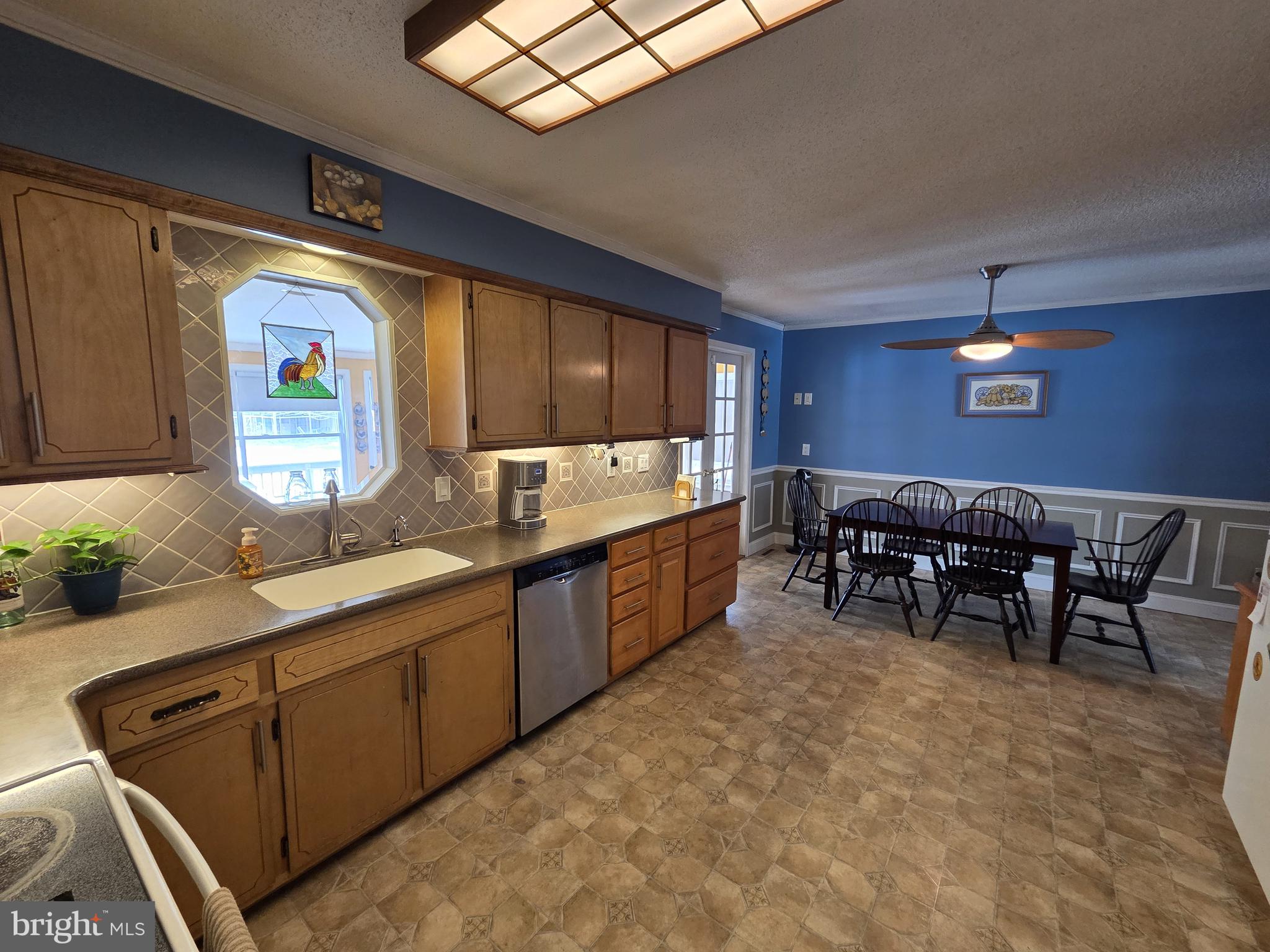 1028 Blackbird Landing Road Townsend, DE 19734 - Photo 3 of 30 a kitchen with lots of counter top space and dining table