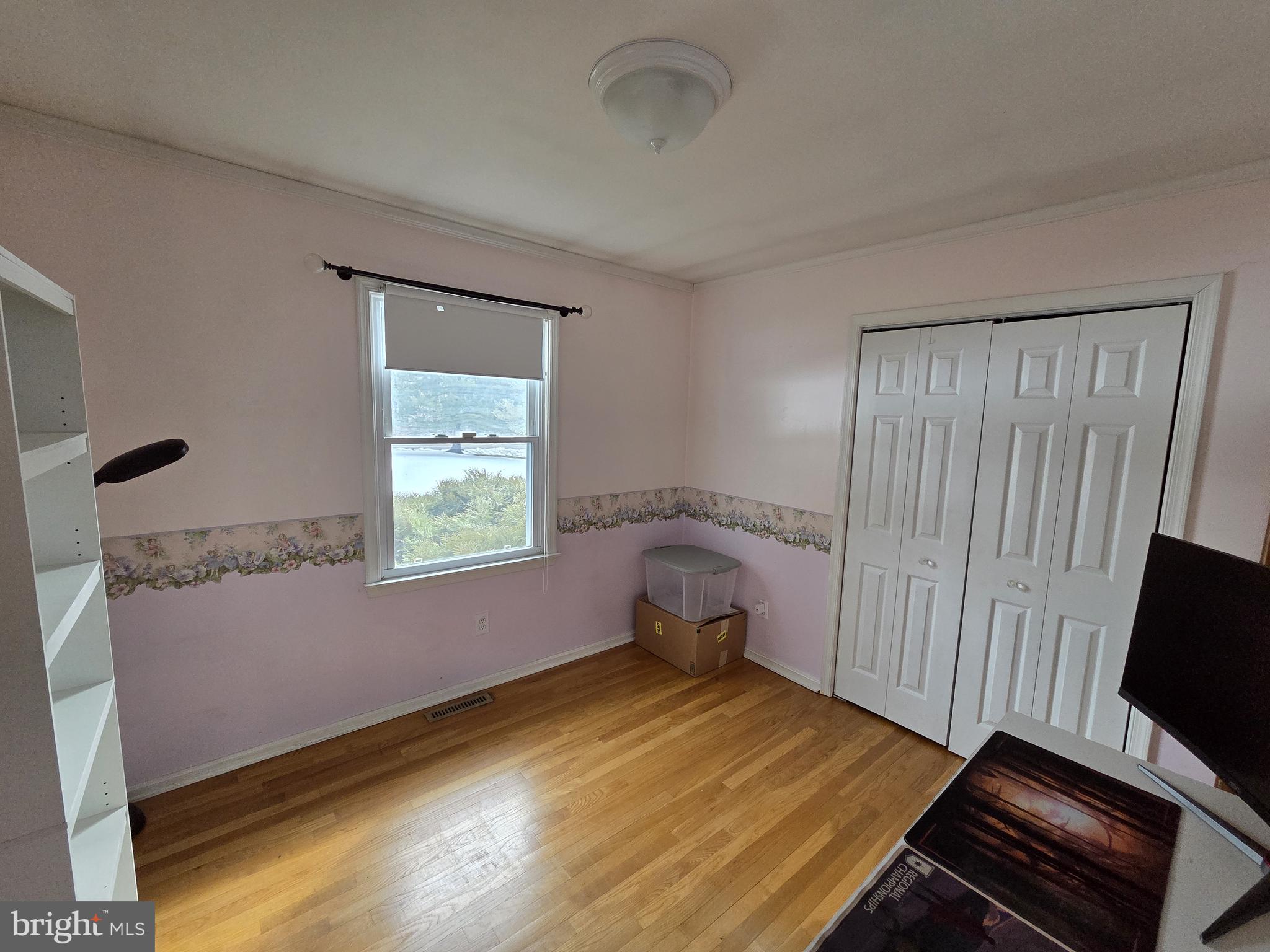 1028 Blackbird Landing Road Townsend, DE 19734 - Photo 10 of 30 a bedroom with a bed and wooden floor
