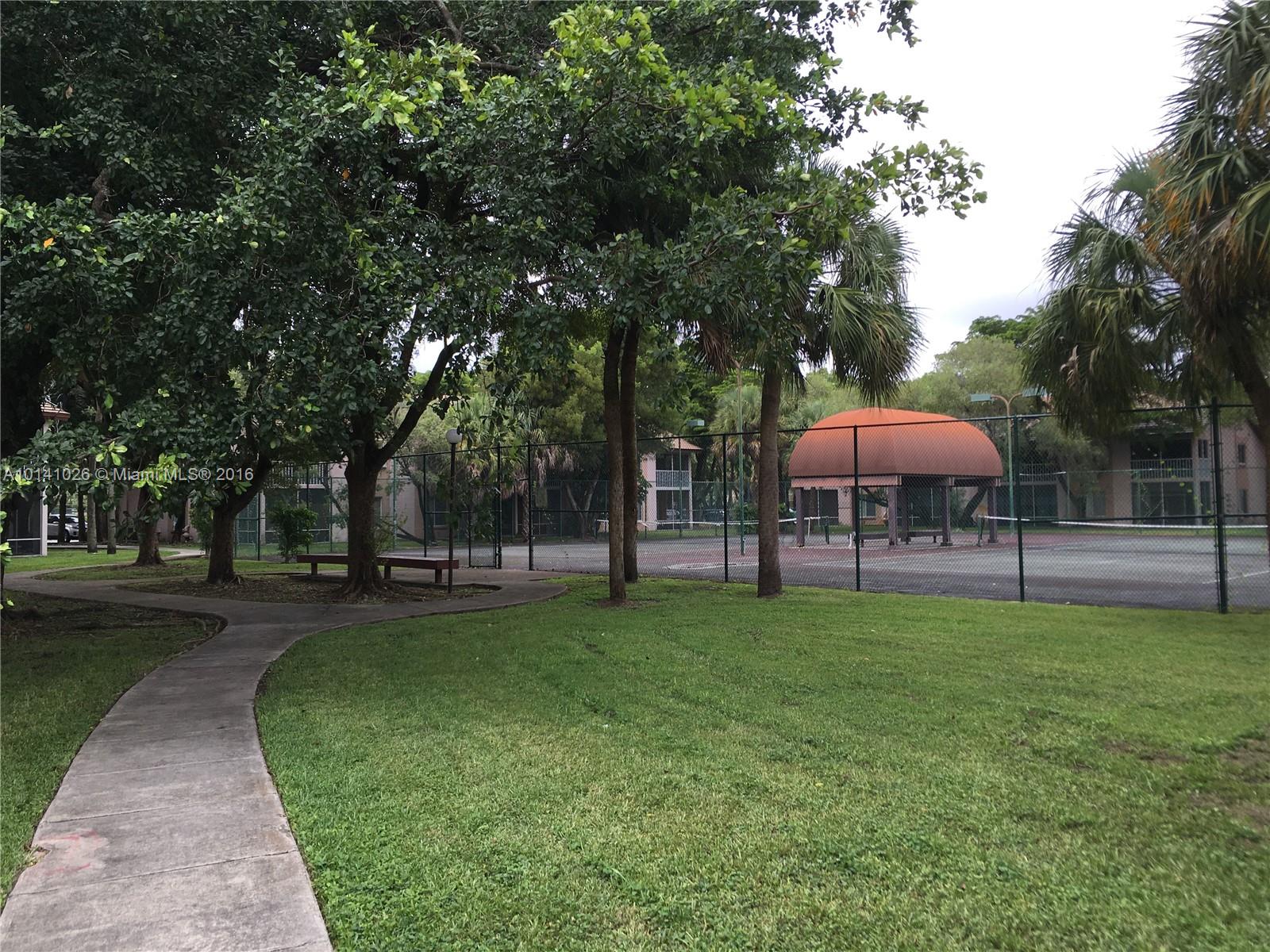 13946 Southwest 90th Terrace, Unit 13946 Miami, FL 33186 - Photo 15 of 16 a view of a park with a slide