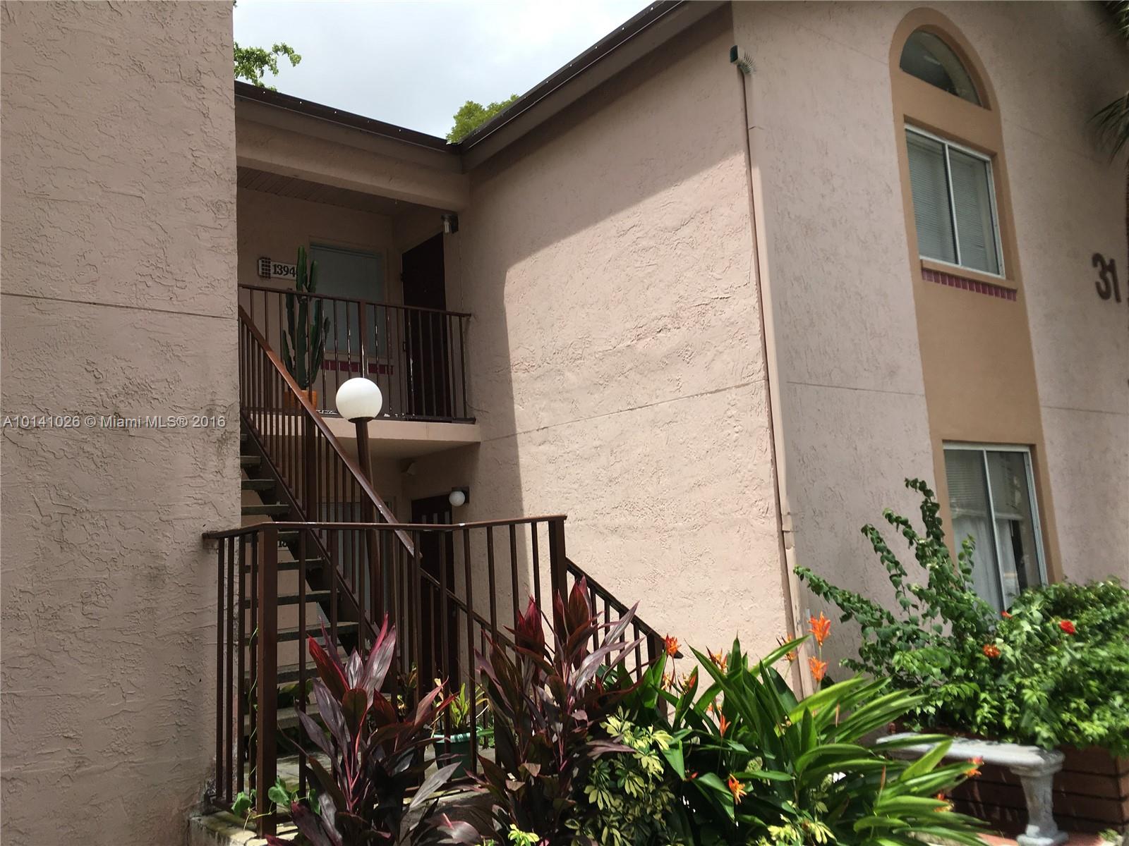 13946 Southwest 90th Terrace, Unit 13946 Miami, FL 33186 - Photo 2 of 16 a view of balcony with furniture