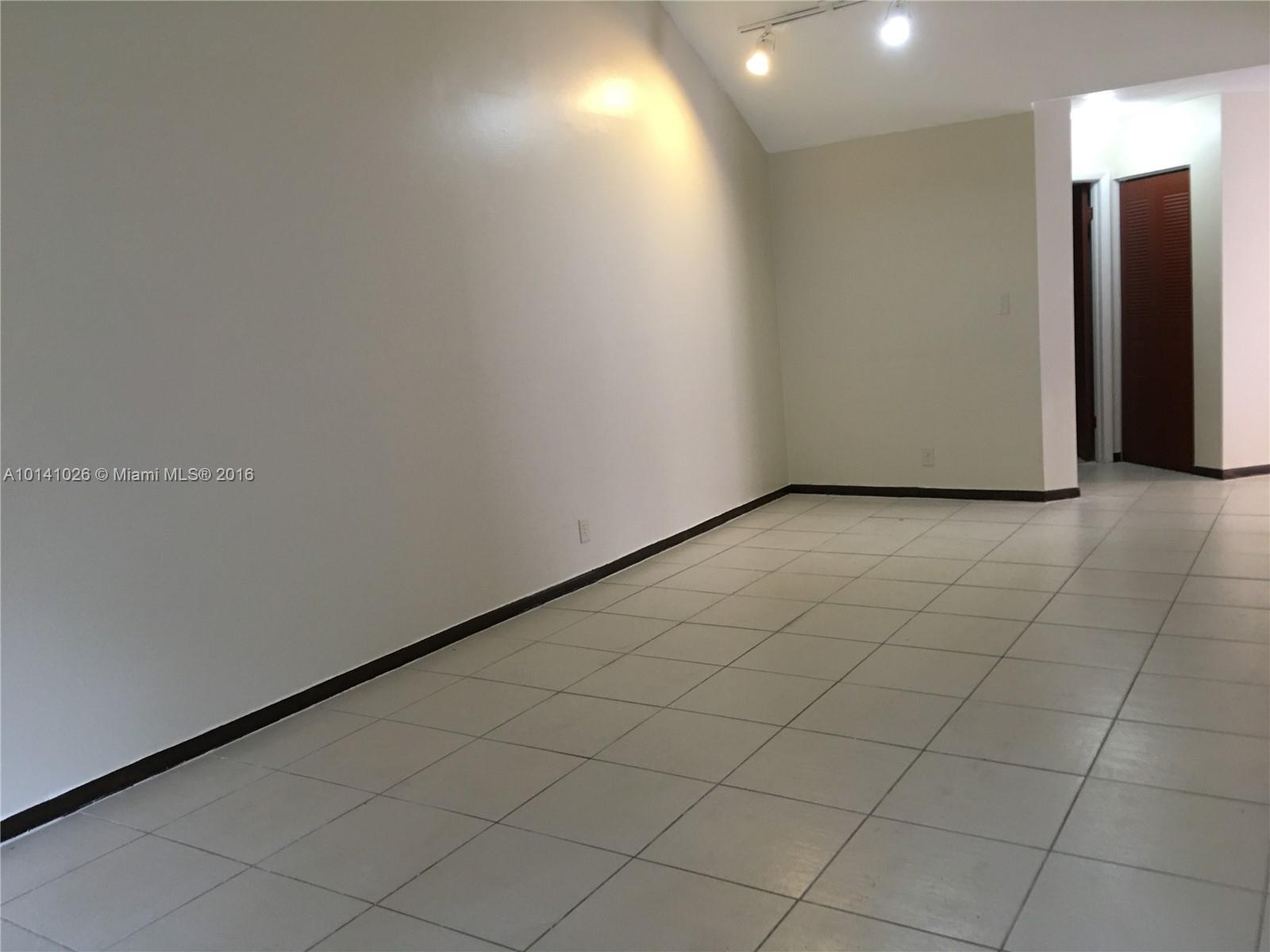 13946 Southwest 90th Terrace, Unit 13946 Miami, FL 33186 - Photo 6 of 16 an empty room with a bathroom