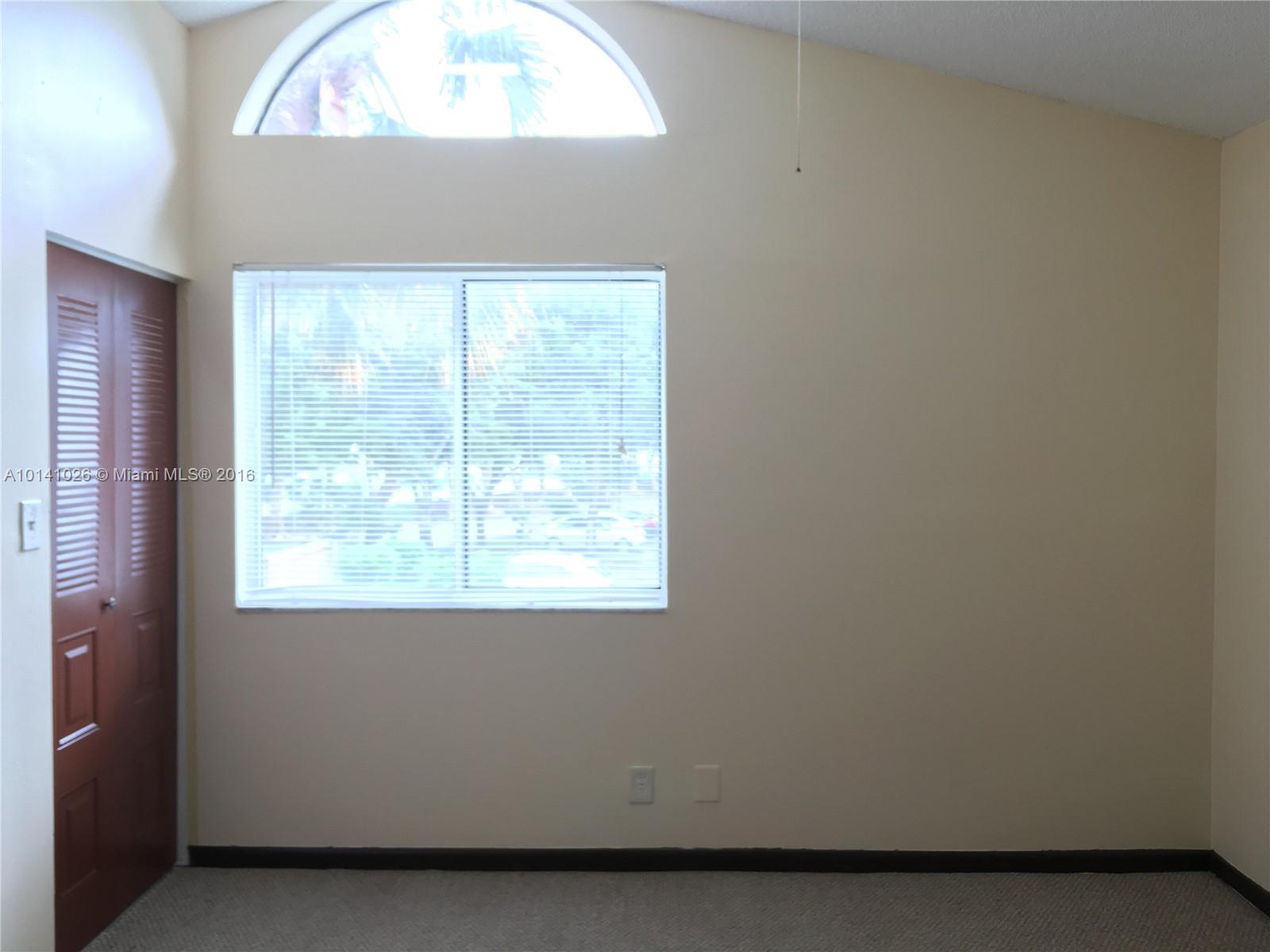 13946 Southwest 90th Terrace, Unit 13946 Miami, FL 33186 - Photo 7 of 16 a room with a window