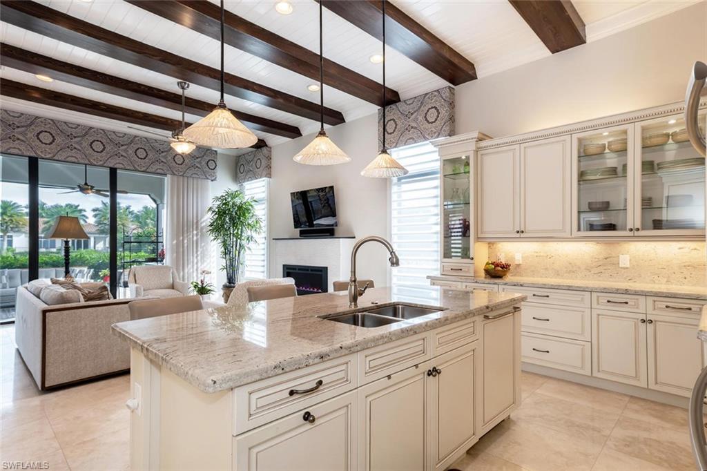a kitchen with stainless steel appliances granite countertop a sink and cabinets
