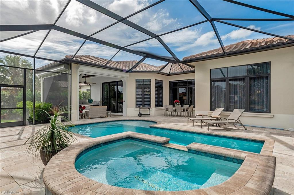 2220 Residence Circle Naples, FL 34105 - Photo 12 of 30 a swimming pool with outdoor seating and yard