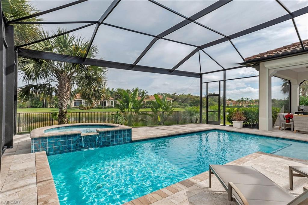 2220 Residence Circle Naples, FL 34105 - Photo 13 of 30 a view of yard from a chairs and table in the patio