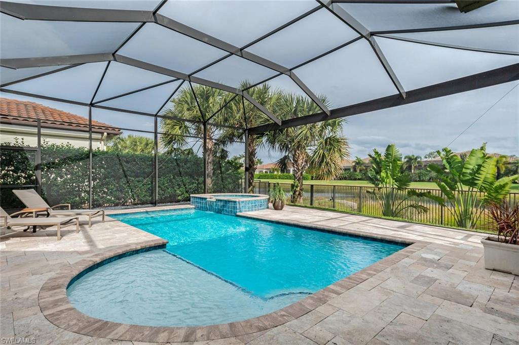 2220 Residence Circle Naples, FL 34105 - Photo 14 of 30 a view of a swimming pool with a patio