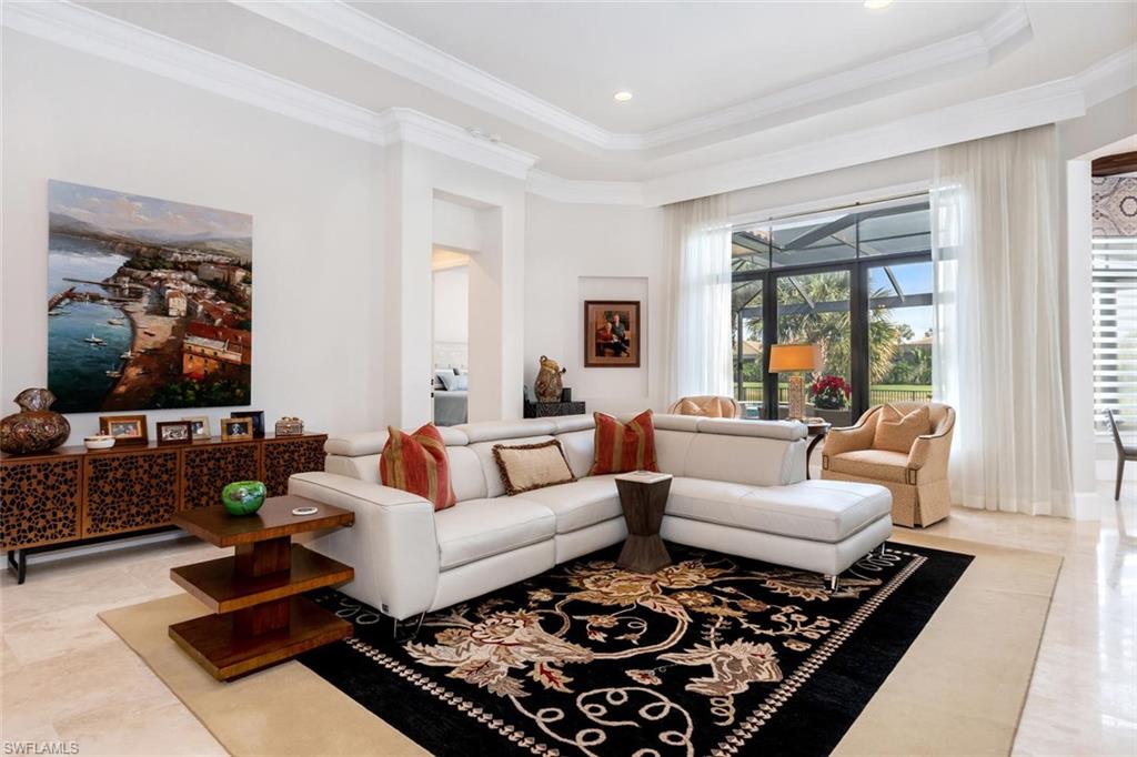 2220 Residence Circle Naples, FL 34105 - Photo 16 of 30 a living room with furniture rug and window