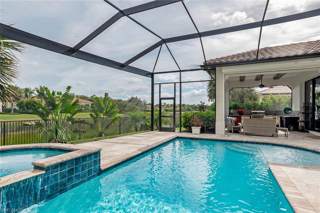 2220 Residence Circle Naples, FL 34105 - Photo 2 of 30 a view of house with swimming pool outdoor seating