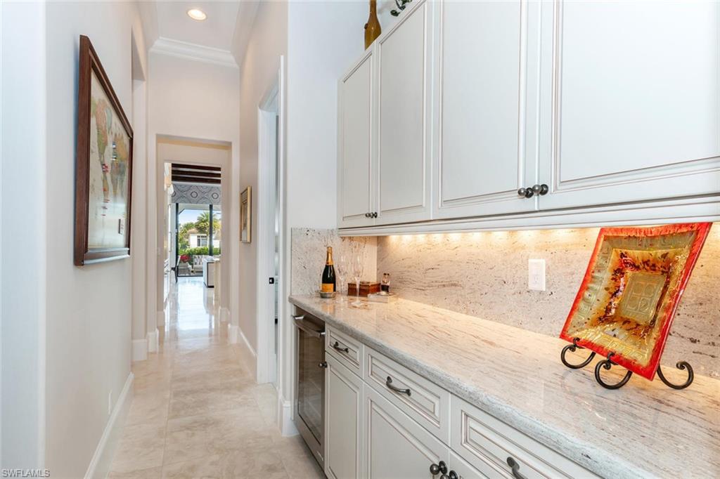 2220 Residence Circle Naples, FL 34105 - Photo 21 of 30 a kitchen with a sink and a window