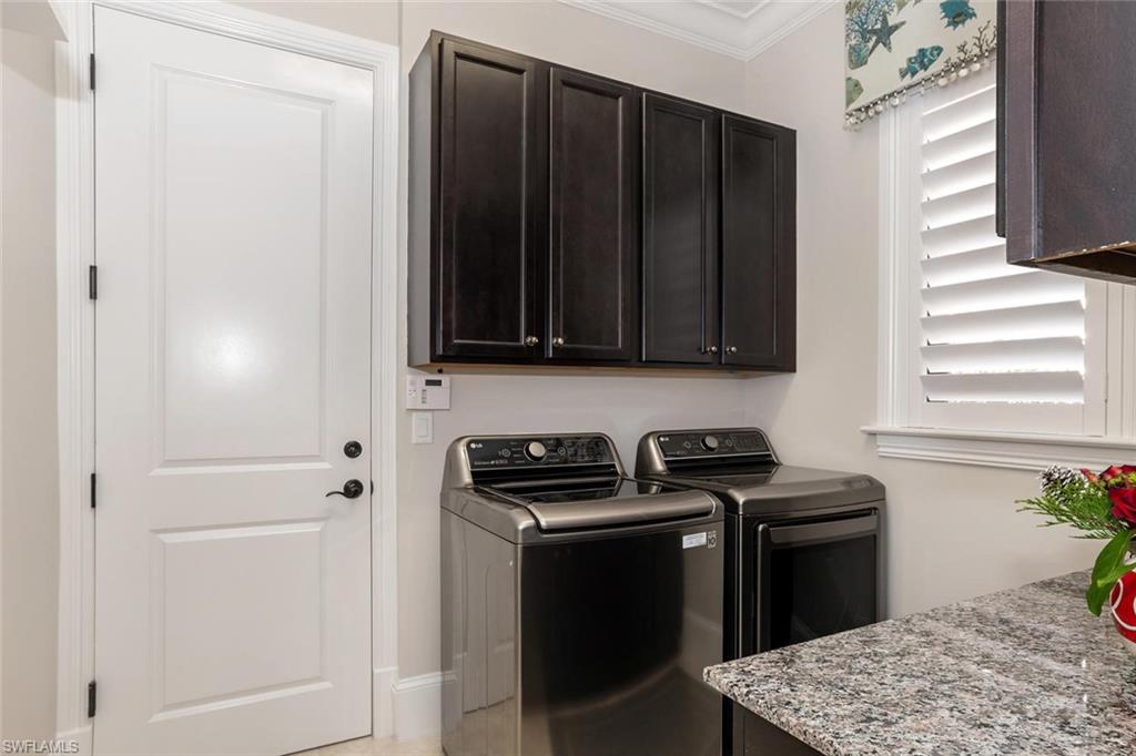 2220 Residence Circle Naples, FL 34105 - Photo 29 of 30 a kitchen with a sink stove and refrigerator