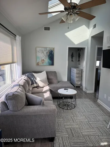 a living room with furniture and a rug