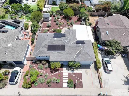 an aerial view of a house with a garden