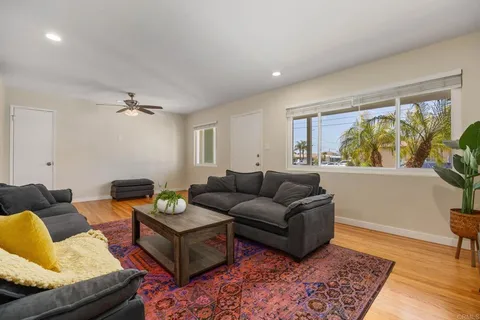 a living room with furniture and a rug