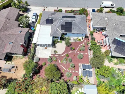 an aerial view of multiple houses with outdoor space