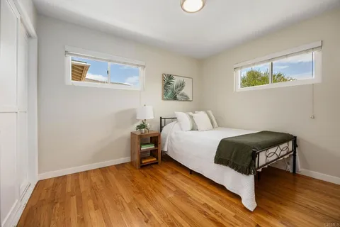 a bedroom with a bed and a desk