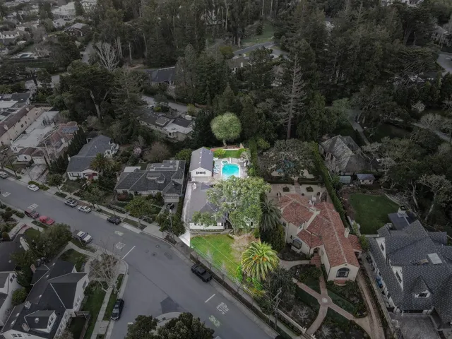 an aerial view of a house with a yard