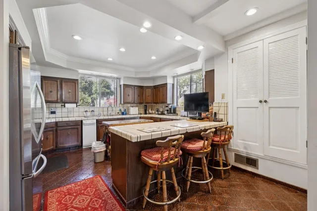 a view of a dining room with furniture and window