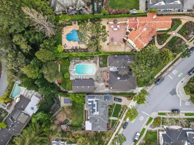 an aerial view of multiple house with a yard