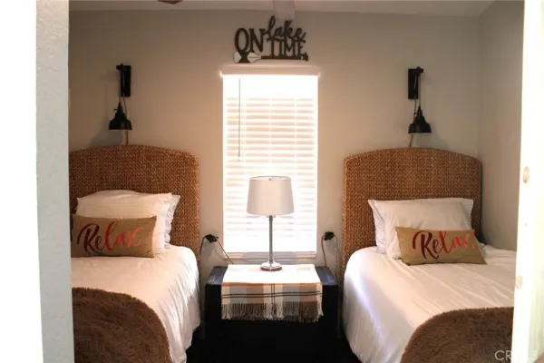 a bedroom with a bed and window