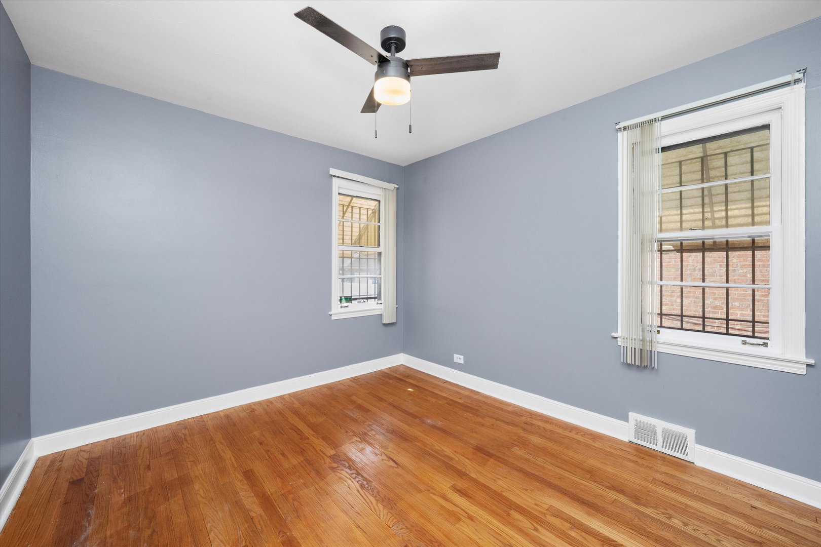3905 West 81st Place Chicago, IL 60652 - Photo 16 of 32 a view of a room with a window and wooden floor