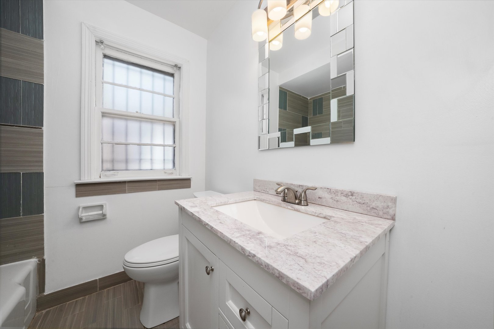 3905 West 81st Place Chicago, IL 60652 - Photo 20 of 32 a bathroom with a granite countertop sink and a toilet