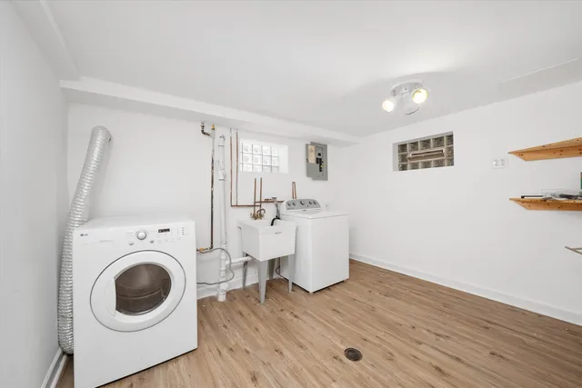 a view of a room with wooden floor and sink